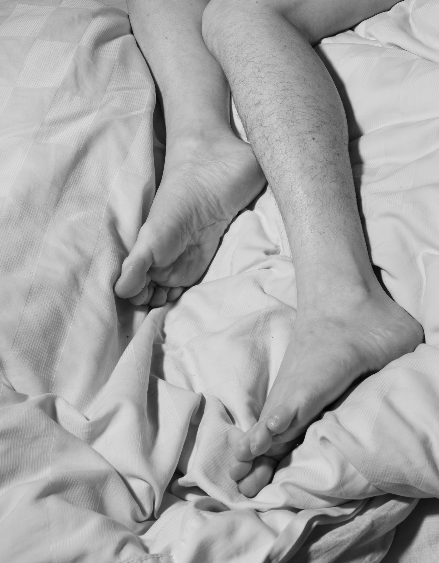 Hairy leg and shaved leg sleep together